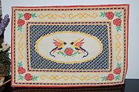 Large cross stitched rug from published pattern - click to see more rugs
